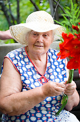 Image showing Grandma with boucket