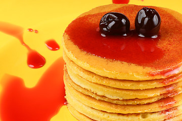 Image showing Pancakes with syrup and sour cherries
