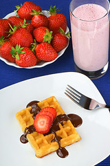 Image showing Waffle with strawberry and chocolate and a milkshake