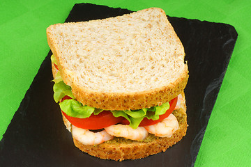 Image showing Sandwich with shrimps, pesto, lettuce and tomato
