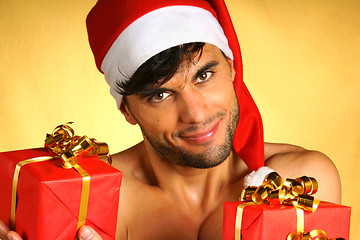 Image showing Sexy Santa Claus with presents