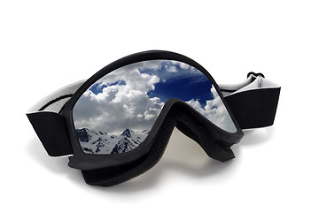 Image showing Ski goggles with reflection of cloudy mountains