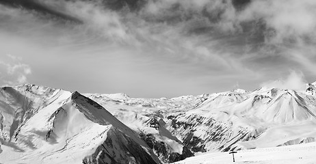 Image showing Black and white panorama of winter snowy mountains