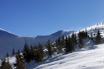 Image showing Winter mountains at sun windy day