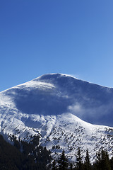 Image showing Winter mountains at sun windy day