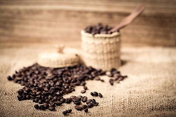 Image showing pile of fresh and bio aromatic coffee beans and spoon