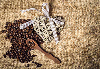 Image showing pile of fresh coffee beans, heart and spoon