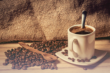 Image showing pile of fresh beans, cap, and spoon