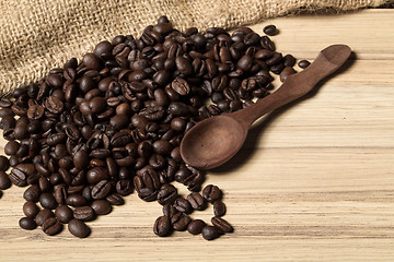 Image showing pile of fresh and bio aromatic coffee beans and spoon