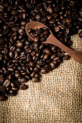 Image showing pile of fresh and bio aromatic coffee beans and spoon