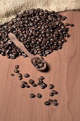 Image showing pile of fresh and bio aromatic coffee beans and spoon