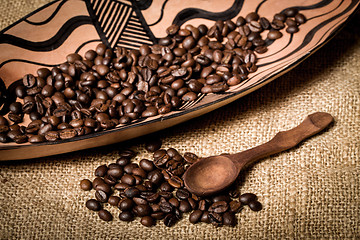 Image showing pile of fresh and bio aromatic coffee beans and spoon