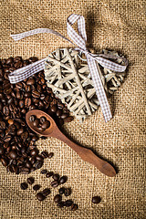 Image showing pile of fresh coffee beans, heart and spoon