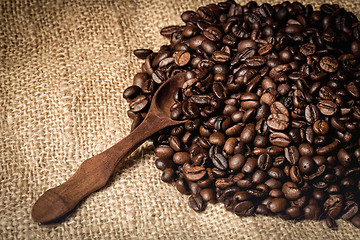 Image showing pile of fresh and bio aromatic coffee beans and spoon