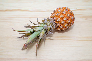 Image showing fresh pineapple on the wooden table