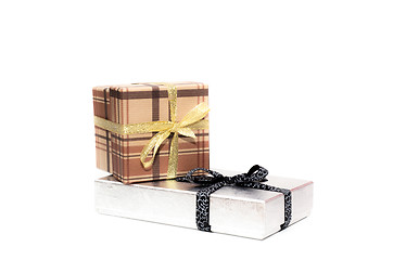 Image showing brown and silver gift box with bow on white background