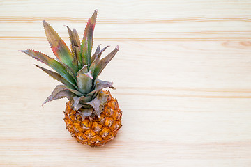 Image showing fresh pineapple on the wooden table