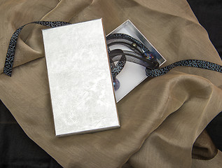 Image showing surprise gift box on the fabric