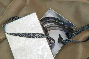 Image showing surprise gift box on the fabric