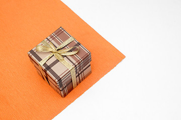 Image showing brown gift box with bow on white background