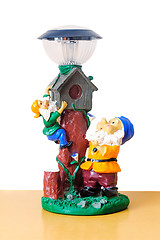 Image showing Original lamp with the image of the dwarves.