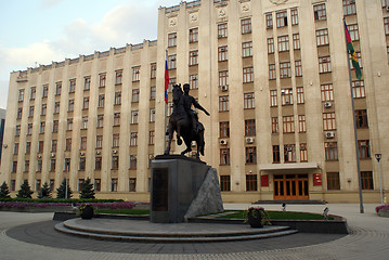 Image showing Man horseback and building