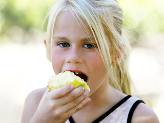 Image showing Girl eating apple