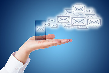 Image showing Email Cloud Leaving Smart Phone Over Blue Ground