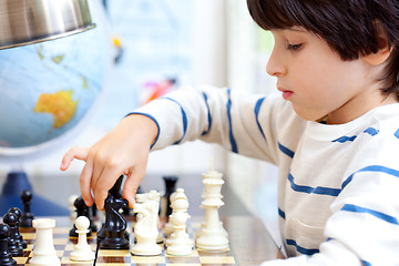 Image showing boy playing a game of chess