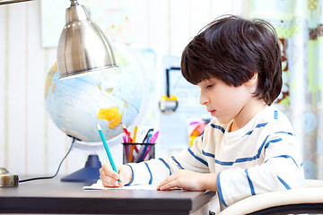 Image showing schoolboy doing homework