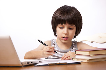 Image showing schoolboy does his homework