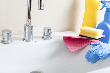Image showing dirty sink and cleaning products