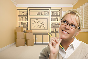 Image showing Daydreaming Woman Holding Pencil In Rom with Shelf Drawing on Wa