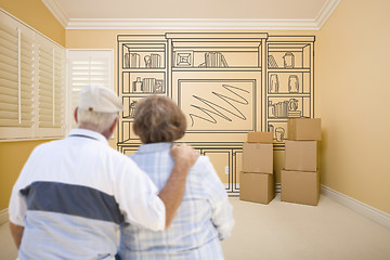 Image showing Senior Couple In Empty Room with Shelf Drawing on Wall