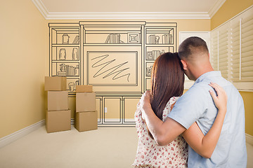 Image showing Military Couple In Empty Room with Shelf Drawing on Wall