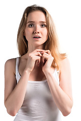 Image showing Attractive surprised woman over white