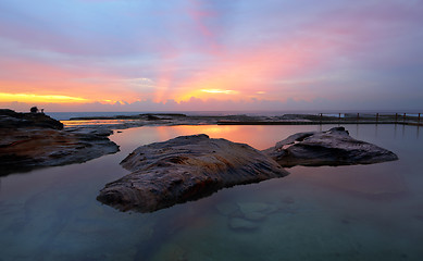Image showing Curl Curl Rock Pool relfections of sunrise