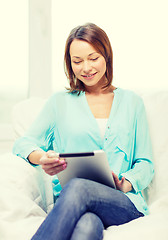 Image showing smiling woman with tablet pc computer at home