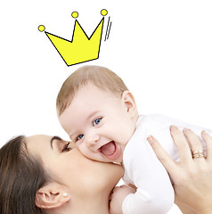 Image showing happy mother kissing and holding baby