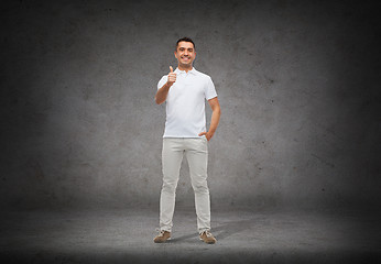 Image showing smiling man showing thumbs up