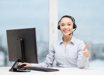 Image showing female helpline operator showing thumbs up
