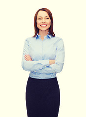 Image showing young smiling businesswoman with crossed arms