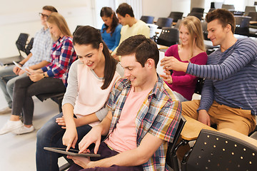 Image showing group of smiling students with tablet pc