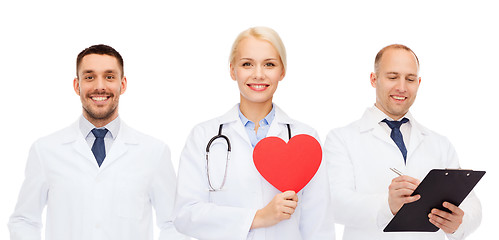 Image showing group of smiling doctors with red heart shape