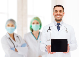 Image showing smiling male doctor with tablet pc