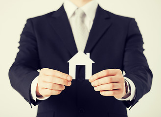 Image showing man hands holding paper house