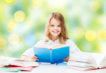 Image showing happy student girl reading book at school