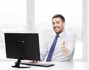 Image showing smiling businessman or student with computer