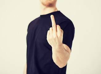 Image showing man showing middle finger