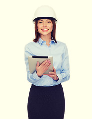 Image showing young smiling businesswoman in white helmet